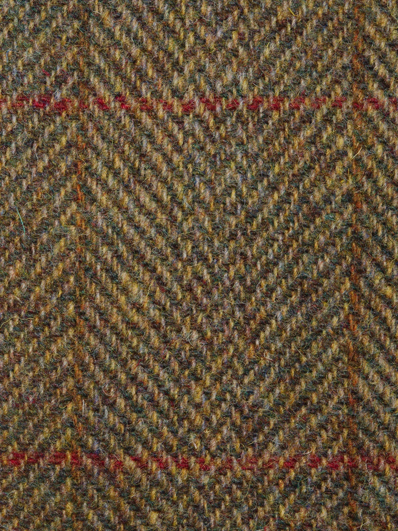 Close-up of a herringbone patterned fabric with earthy tones.