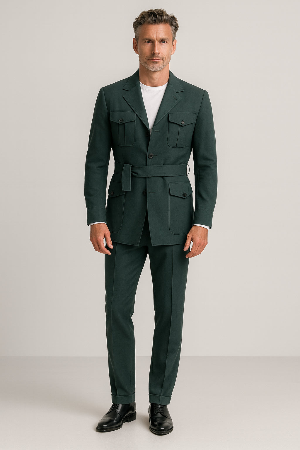 Man wearing a green suit with a white shirt on a plain background