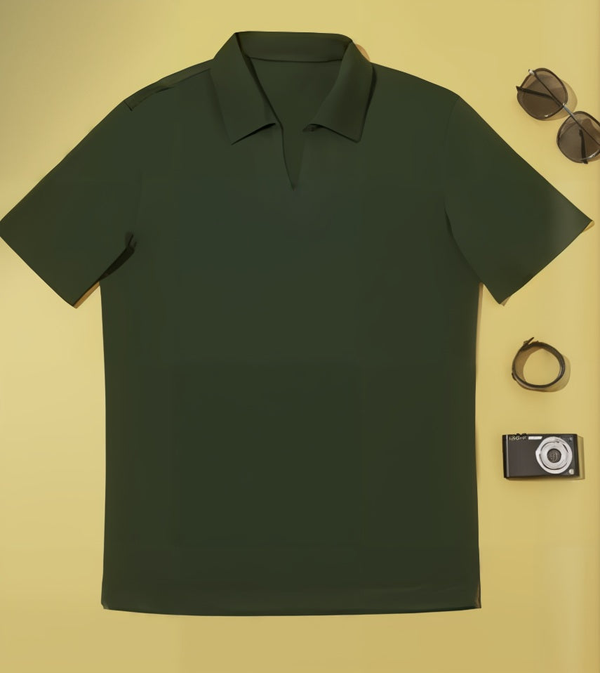 Green polo shirt on a yellow background with sunglasses, camera, and belt.