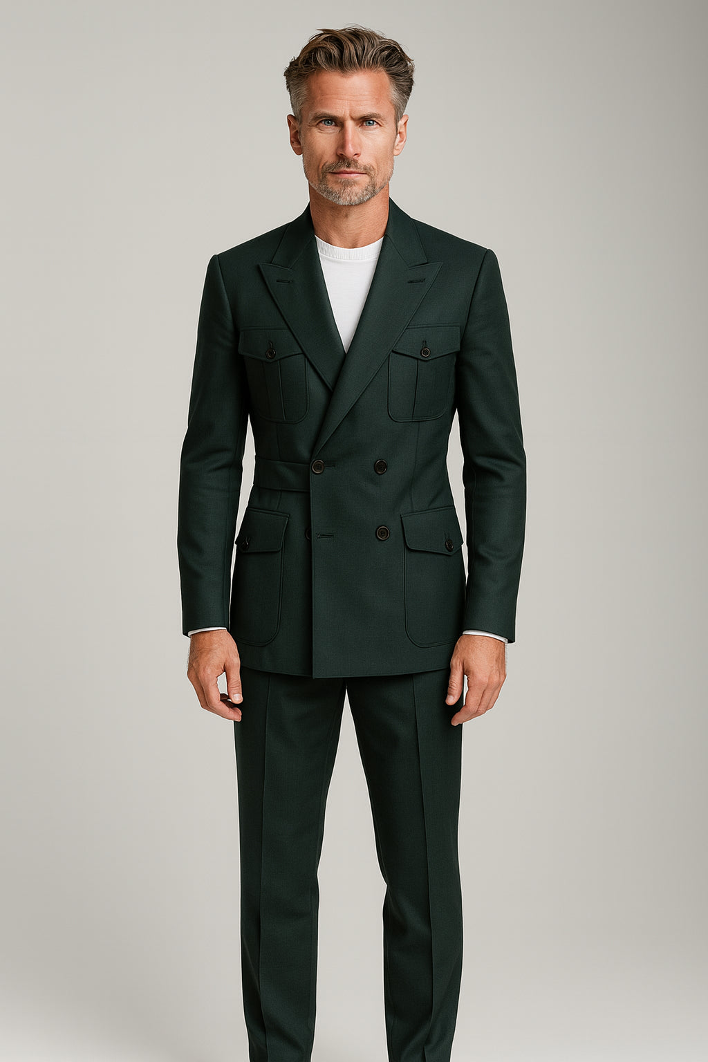 Man wearing a dark green suit against a plain background