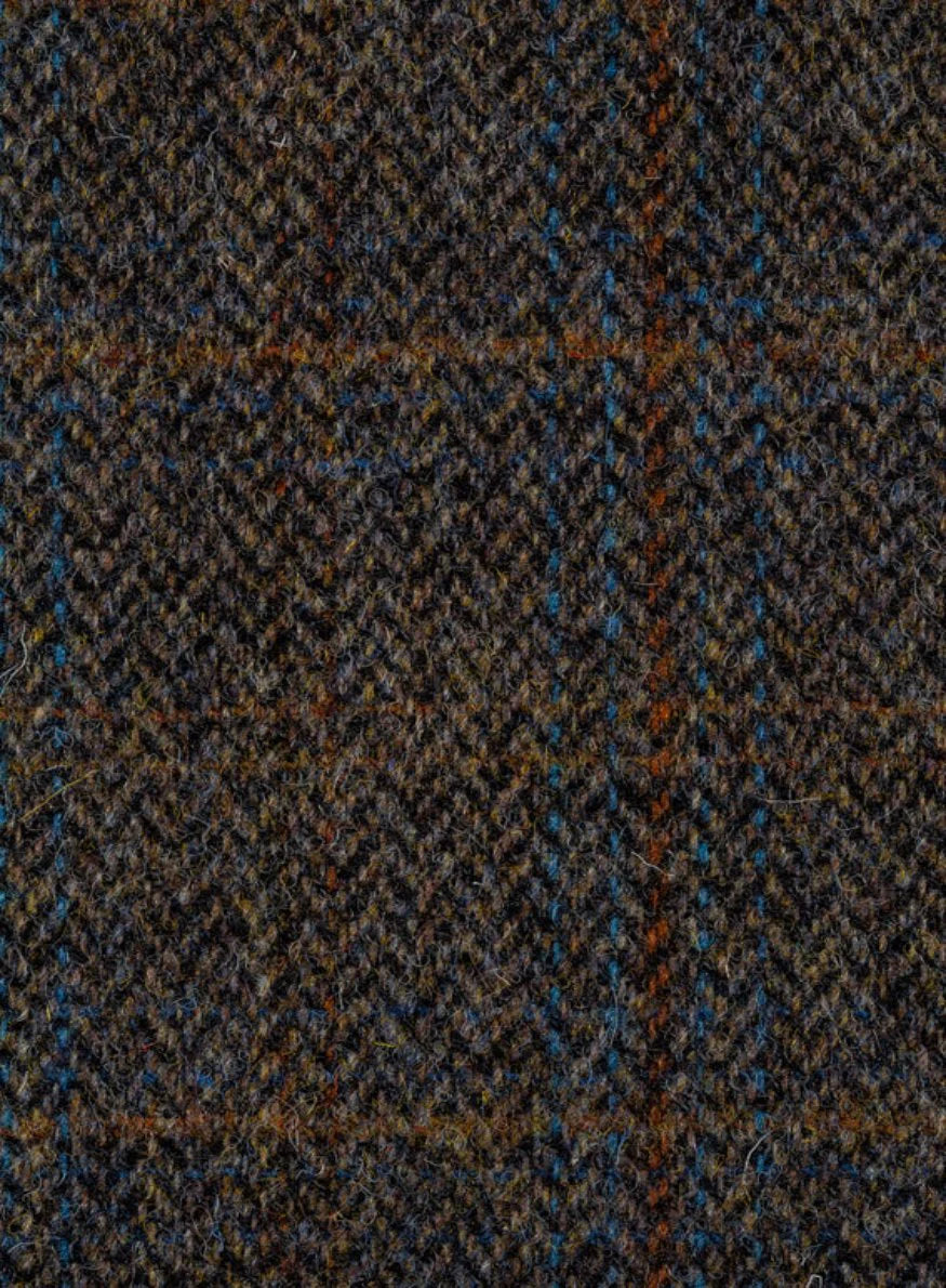 Tweed fabric in a grey & brown herringbone with a rusty orange and blue overcheck.