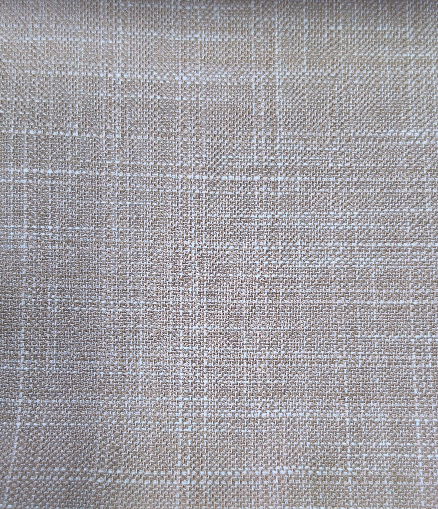 A close-up of woven fabric with a subtle plaid pattern in beige and off-white.