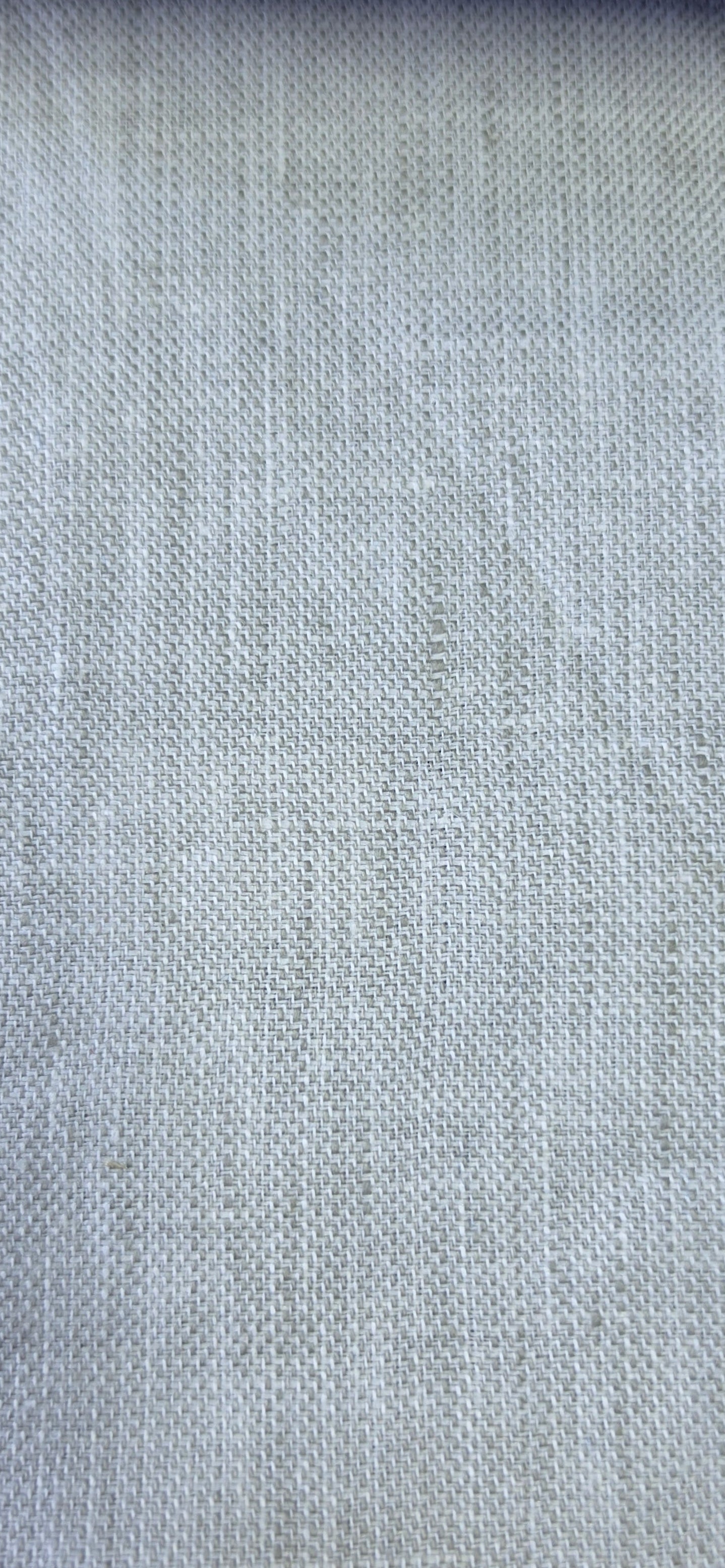 A close-up of a light Stone woven fabric swatch with a visible zigzag-cut edge, shown against a neutral background.