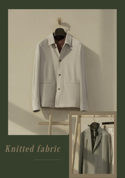 A beige knitted fabric jacket displayed on a hanger against a textured background, with the interior of the jacket shown in a inset image, indicating a sleeveless design with a collar and three buttons down the front.