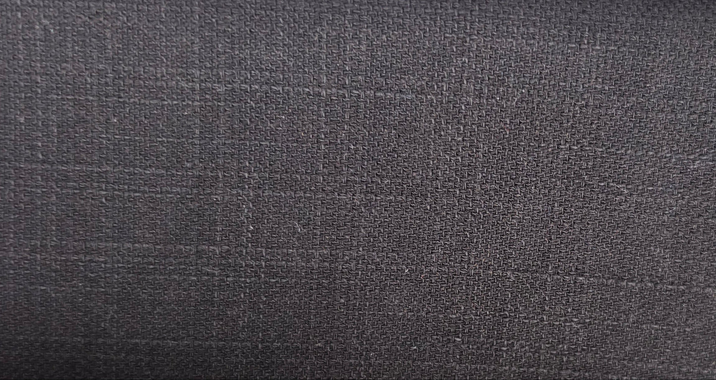 A close-up of a dark charcoal gray textured fabric with a subtle woven grid pattern.
