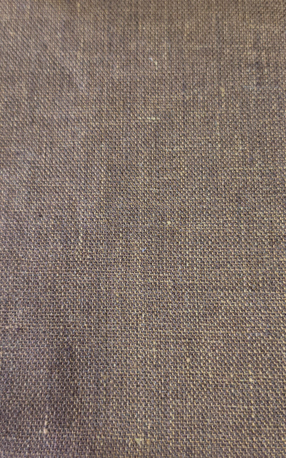 A close-up of a woven fabric texture in a medium brown color, showing the detailed weave pattern.