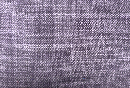 A close-up of a woven fabric texture in a muted lavender-gray color, showing the detailed weave pattern.