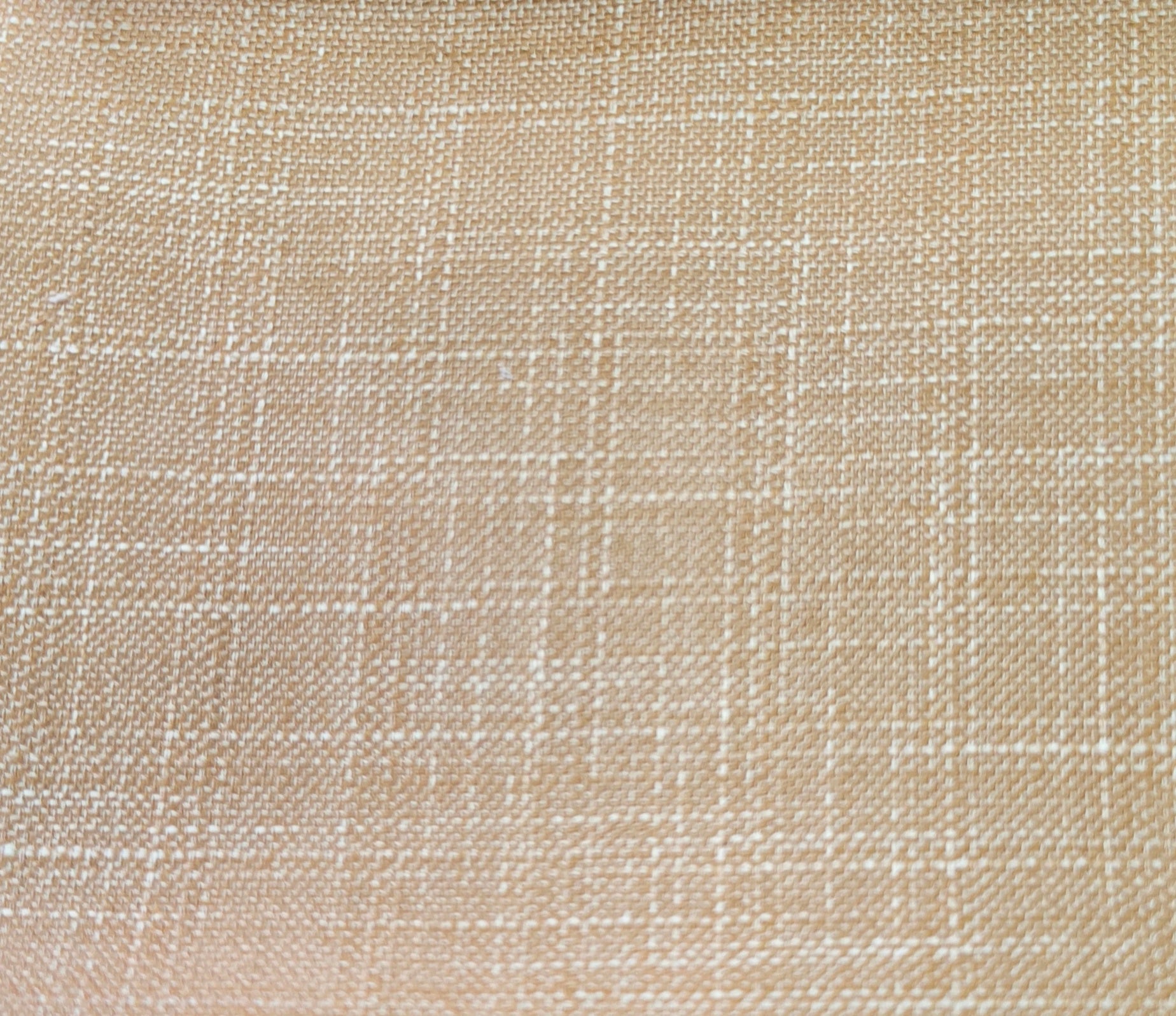 A close-up of a woven fabric texture in a warm beige color with a subtle white grid pattern.