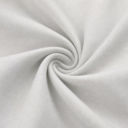 A close-up of light Ivory fabric arranged in a spiral swirl, showing the material texture and drape.
