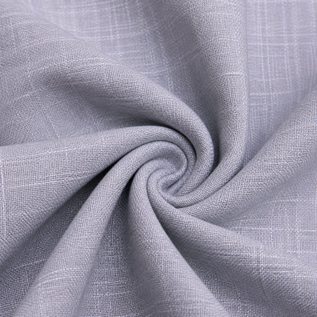 A close-up of light gray woven fabric with a subtle plaid texture, arranged in a spiral drape to show the material's texture and flexibility.