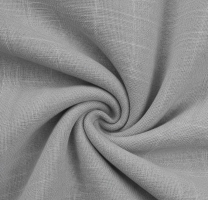 A close-up of light gray woven fabric with a subtle textured pattern, arranged in a spiral drape to show the material's texture and drape.