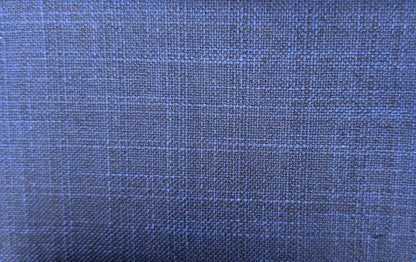 A close-up of woven fabric texture in a medium-to-dark blue color with subtle lighter blue and gray plaid lines.
