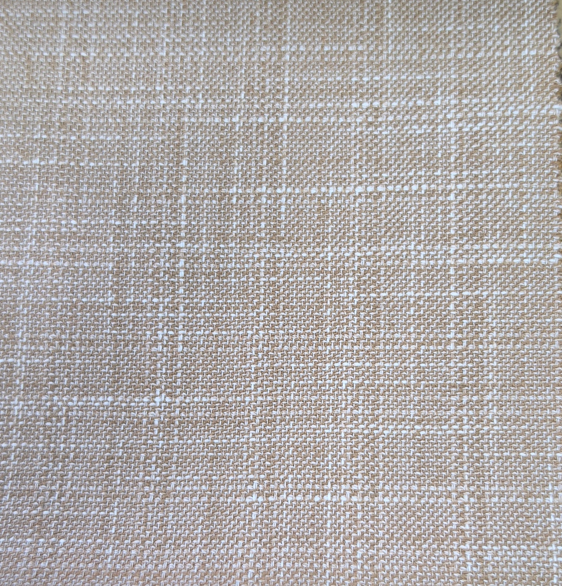 A close-up of woven fabric with a subtle plaid pattern in beige and off-white.
