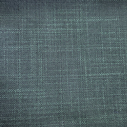 A close-up of woven fabric with a subtle plaid pattern in dark teal and gray tones.