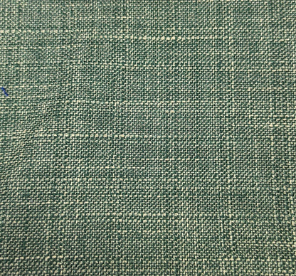 A close-up of woven fabric with a textured, basketweave-like pattern in muted green and beige tones.