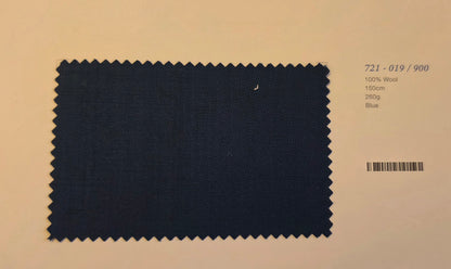 A dark blue textured fabric swatch with serrated edges displayed on a beige background next to printed product details.