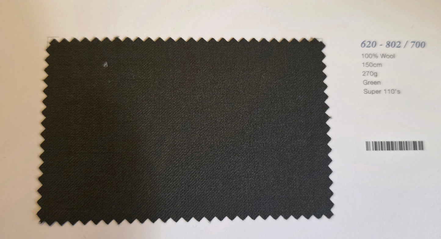 A dark charcoal gray fabric swatch with serrated edges, displayed on a white card next to printed specifications.