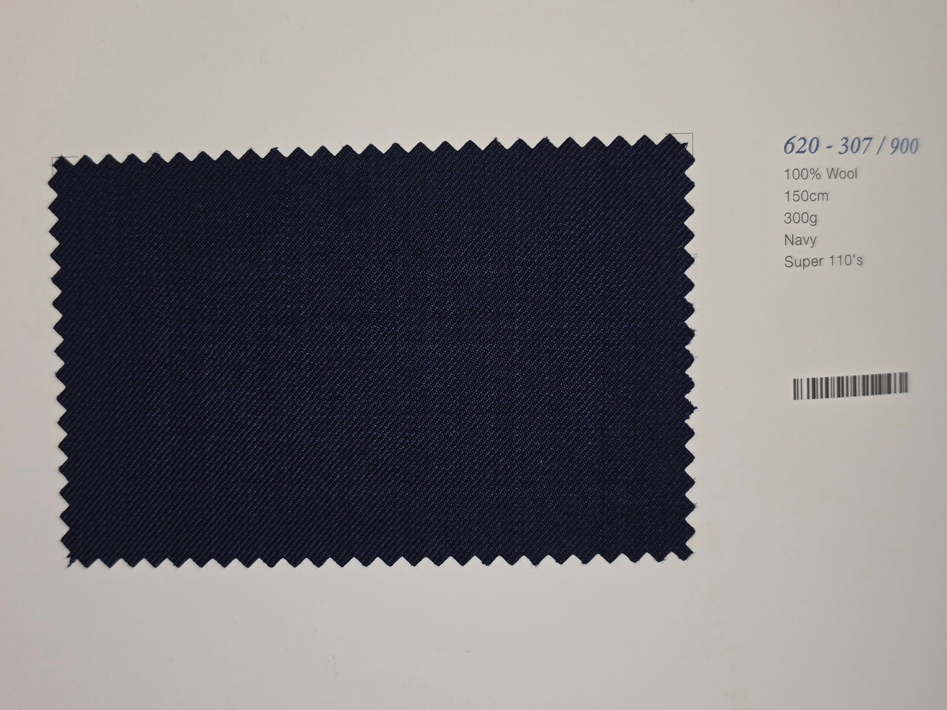 A dark Purple fabric swatch with zigzag-cut edges, displayed on a white background next to printed specifications including '620 - 307 / 900', '100% Wool', '150cm', '300g', 'Navy', and 'Super 110's'.