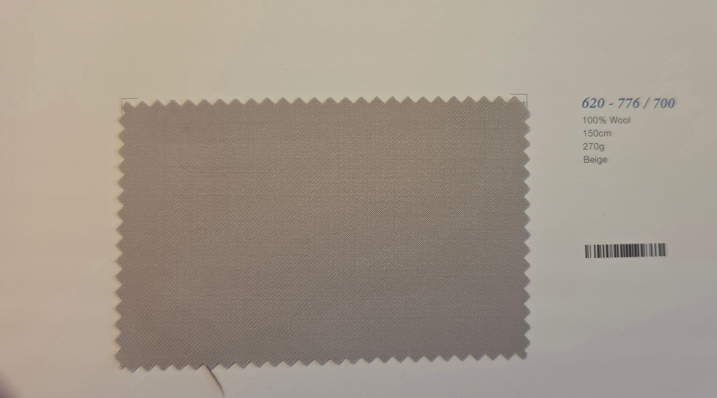 A fabric color swatch card showing a beige woven wool sample with serrated edges, alongside printed text including '620 - 776 / 700', '100% Wool', '150m', '270g', and 'Beige'.