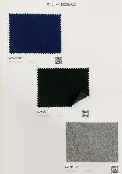 A fabric color swatch card showing three rectangular material samples labeled DAV9940, DAV9941, and DAV9942 under the heading 'MODERN BUSINESS'. The top sample is dark navy blue, the middle is black, and the bottom is light gray.