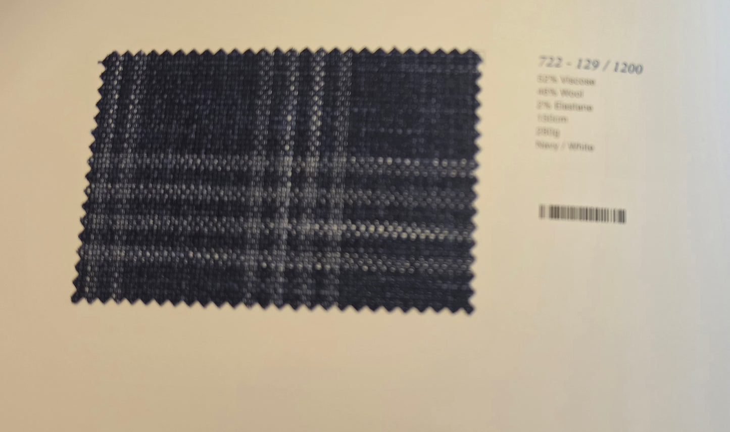 A fabric swatch card displaying a dark navy blue and white plaid pattern, with technical specifications printed on the right side against a light beige background.