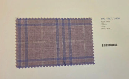 A fabric swatch card showing a purple and blue plaid pattern on a light background, with printed text on the right indicating wool composition and color details.