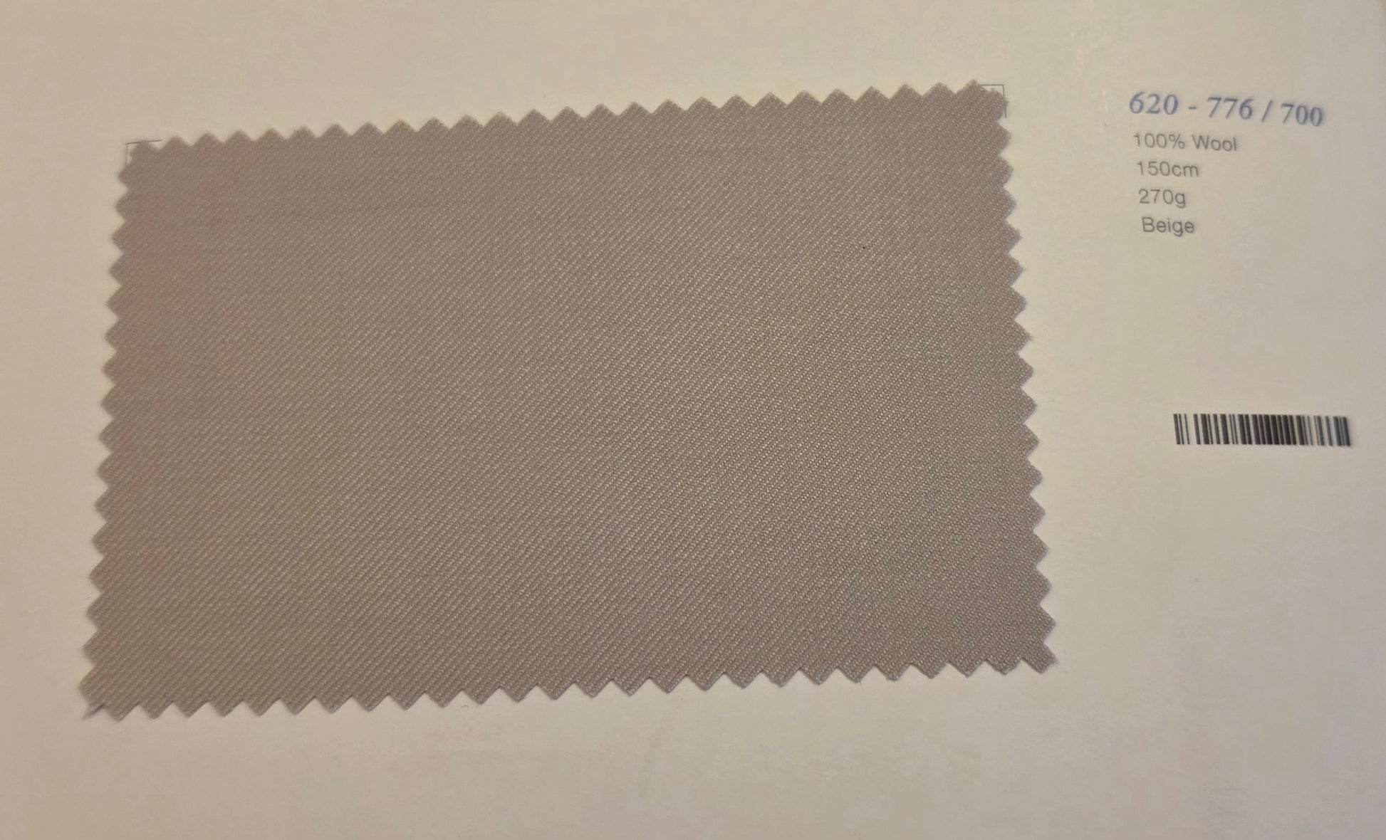 A fabric swatch card showing a textured beige wool material with serrated edges, alongside printed color and specification details on a white background.