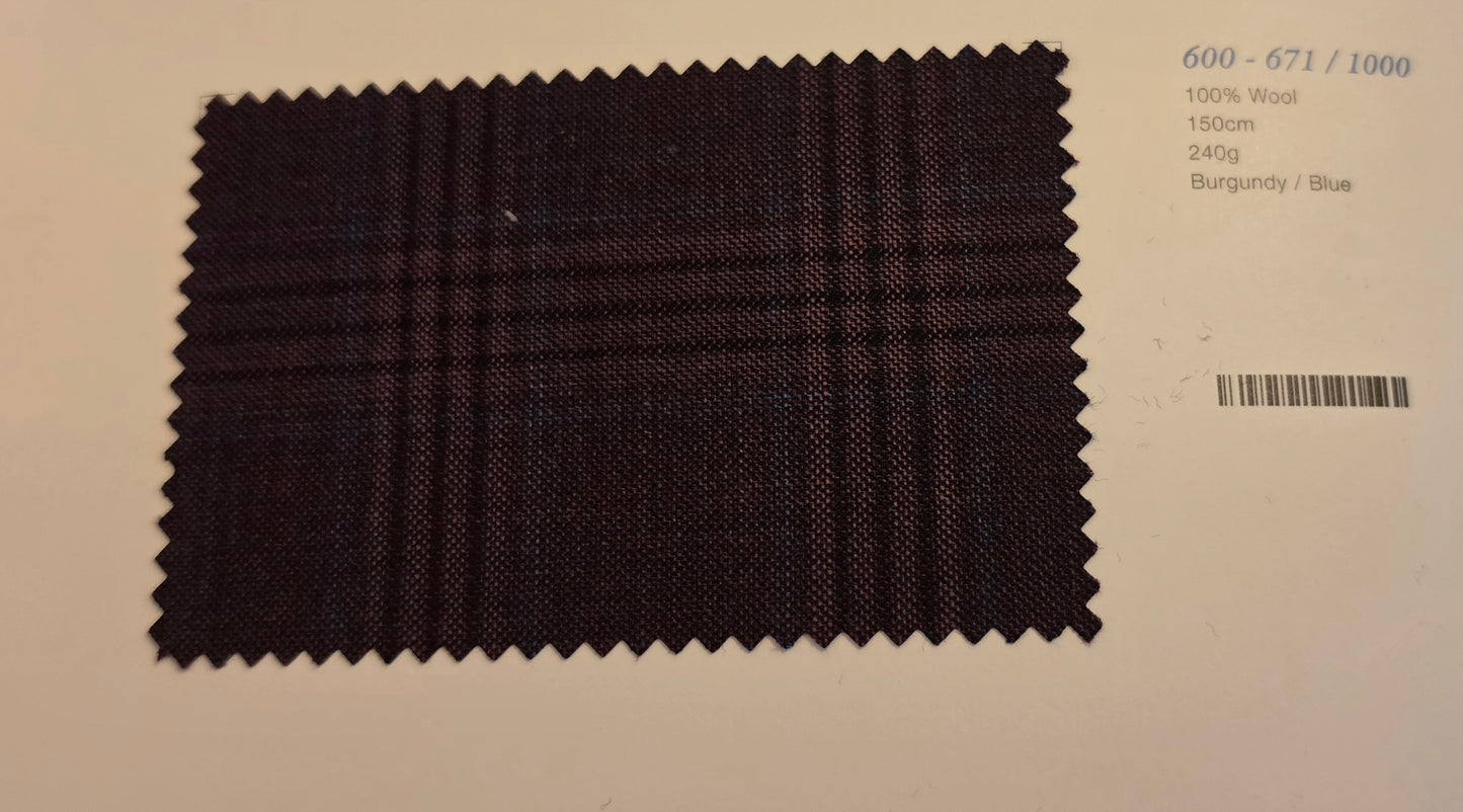 A fabric swatch of dark burgundy and blue plaid wool, displayed on a light beige background with printed details on the right.