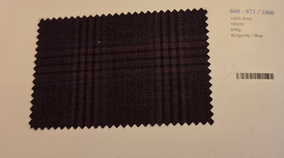 A fabric swatch of dark burgundy and blue plaid wool, displayed on a light beige background with printed details on the right.