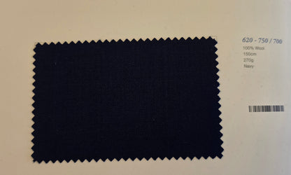 A fabric swatch of dark navy wool with serrated edges, displayed on a light beige background with printed specifications on the right.