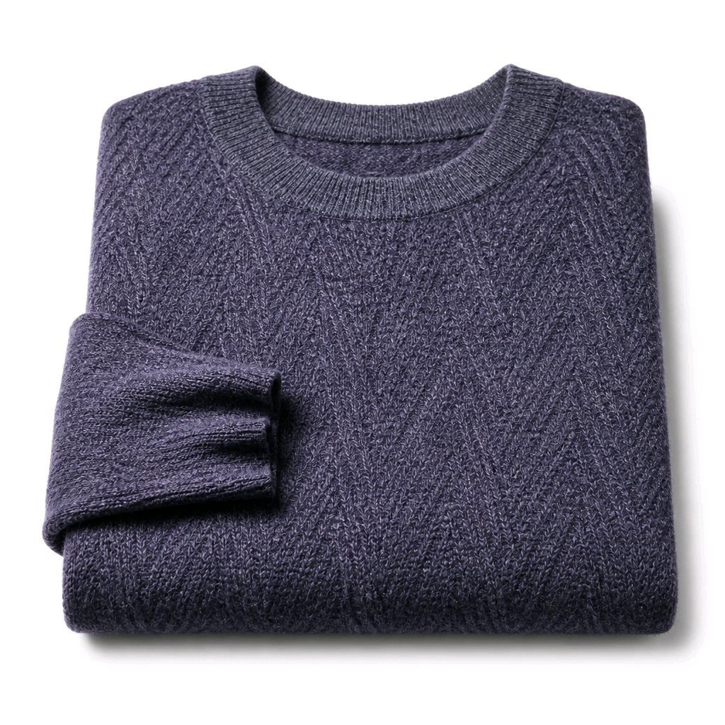 A folded crewneck knit sweater in a heathered dark blue-gray color, displayed on a clean white background.