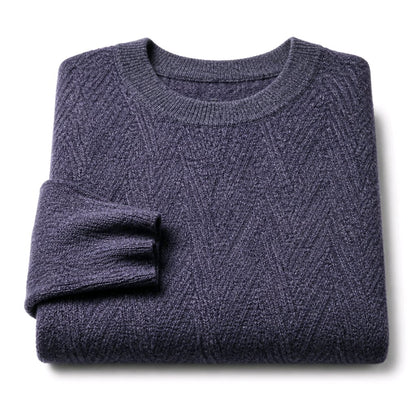 A folded crewneck knit sweater in a heathered dark blue-gray color, displayed on a clean white background.