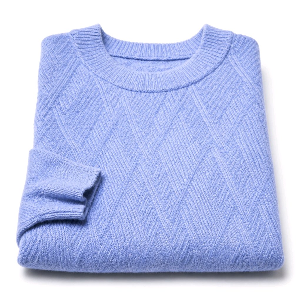 A folded light blue knit sweater with a textured diamond pattern, shown on a clean white background.