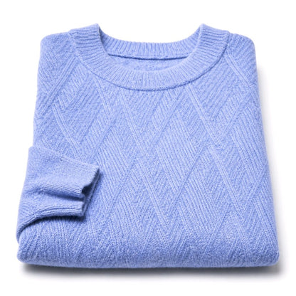 A folded light blue knit sweater with a textured diamond pattern, shown on a clean white background.