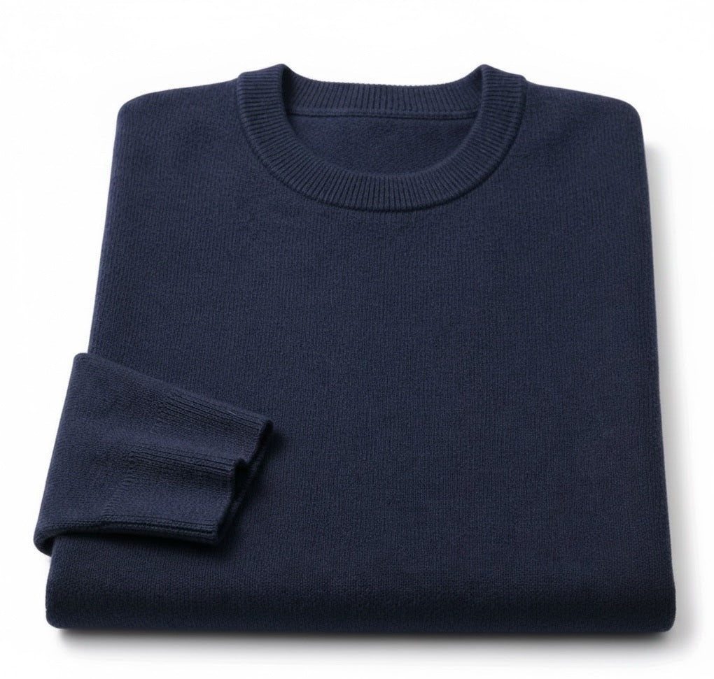 A folded navy blue crewneck sweater on a clean white background.