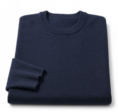 A folded navy blue crewneck sweater on a clean white background.