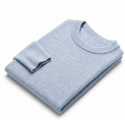 A light blue folded crewneck knit sweater on a clean white background.