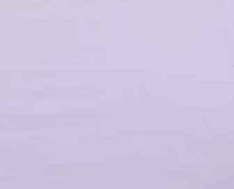 A light lavender long-sleeve button-up dress shirt hanging on a wooden hanger from a rustic wooden peg rail on a textured off-white wall.