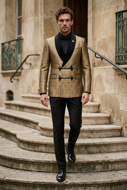 A man walks down stone stairs wearing a gold patterned double-breasted blazer with black satin lapels, black trousers, and a black bow tie.