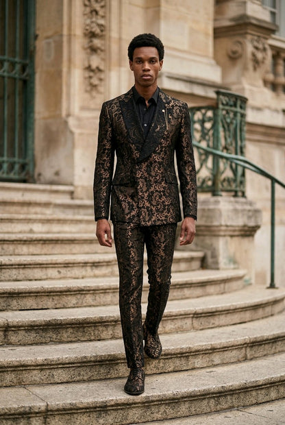 A man wearing a black and brown floral lace suit walks down stone steps in front of a classical stone building.