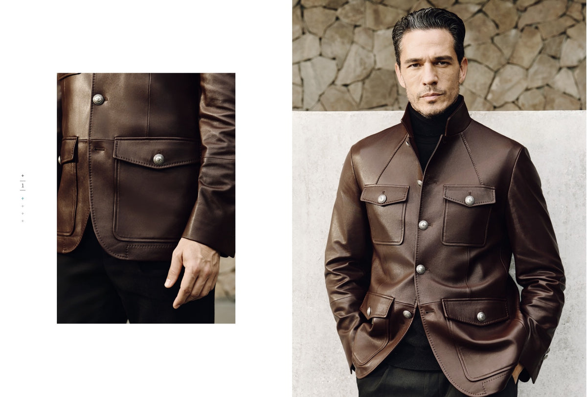 A man wearing a dark brown leather jacket with silver snap buttons and flap pockets, styled over a black turtleneck. The image is a split composition, featuring a close-up of the jacket's chest and pocket details on the left, and a full-body shot of the model on the right against a stone wall background.