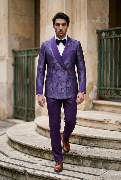 A man wearing a purple patterned double-breasted suit with satin lapels, a white shirt, and a black bow tie walks down stone steps outdoors.