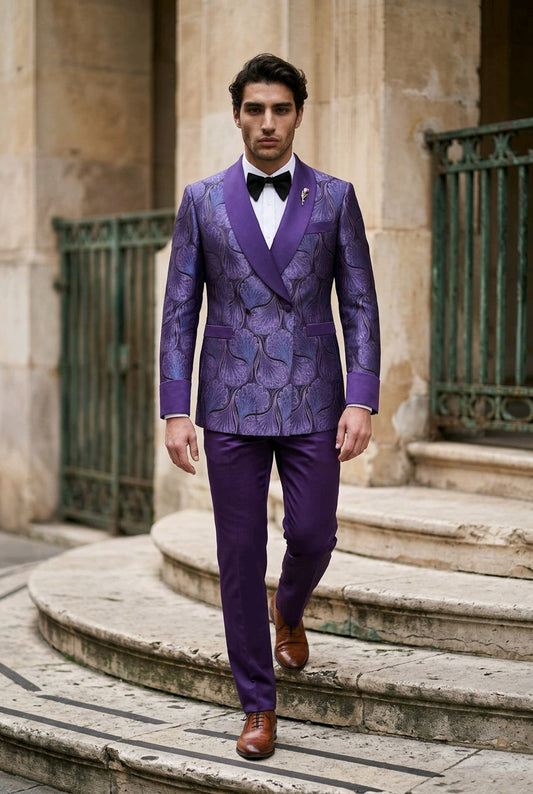 A man wearing a purple patterned double-breasted suit with satin lapels, a white shirt, and a black bow tie walks down stone steps outdoors.