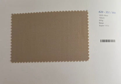 A rectangular beige wool fabric swatch with serrated edges on a white background, next to printed text showing color and material details.
