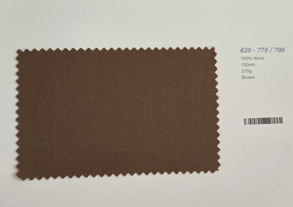 A rectangular brown wool fabric swatch with serrated edges, displayed on a white background with printed text on the right detailing its specifications: 620-778/700, 100% Wool, 150cm, 270g, and Brown.