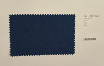 A rectangular fabric swatch with zigzag-cut edges in dark blue wool, shown on a light beige background with printed text reading '721-019/900', '100% Wool', '150g', '280g', and 'Blue'.
