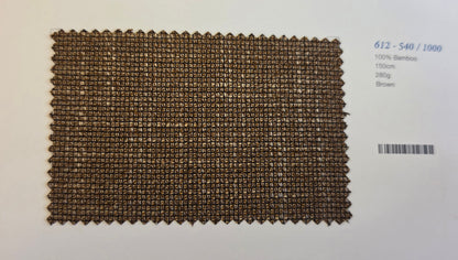 A rectangular woven bamboo fabric swatch in brown, displayed on a white background next to printed text with a barcode.