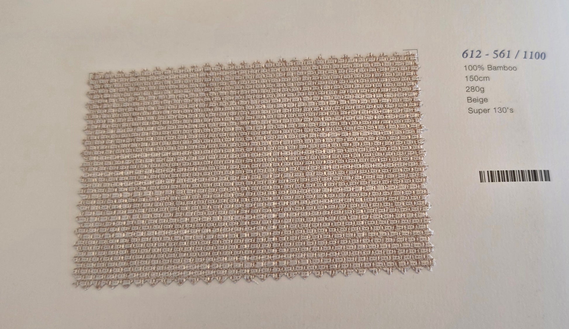 A rectangular woven bamboo mesh fabric swatch in beige, displayed on a white background with product code and barcode text printed on the right.