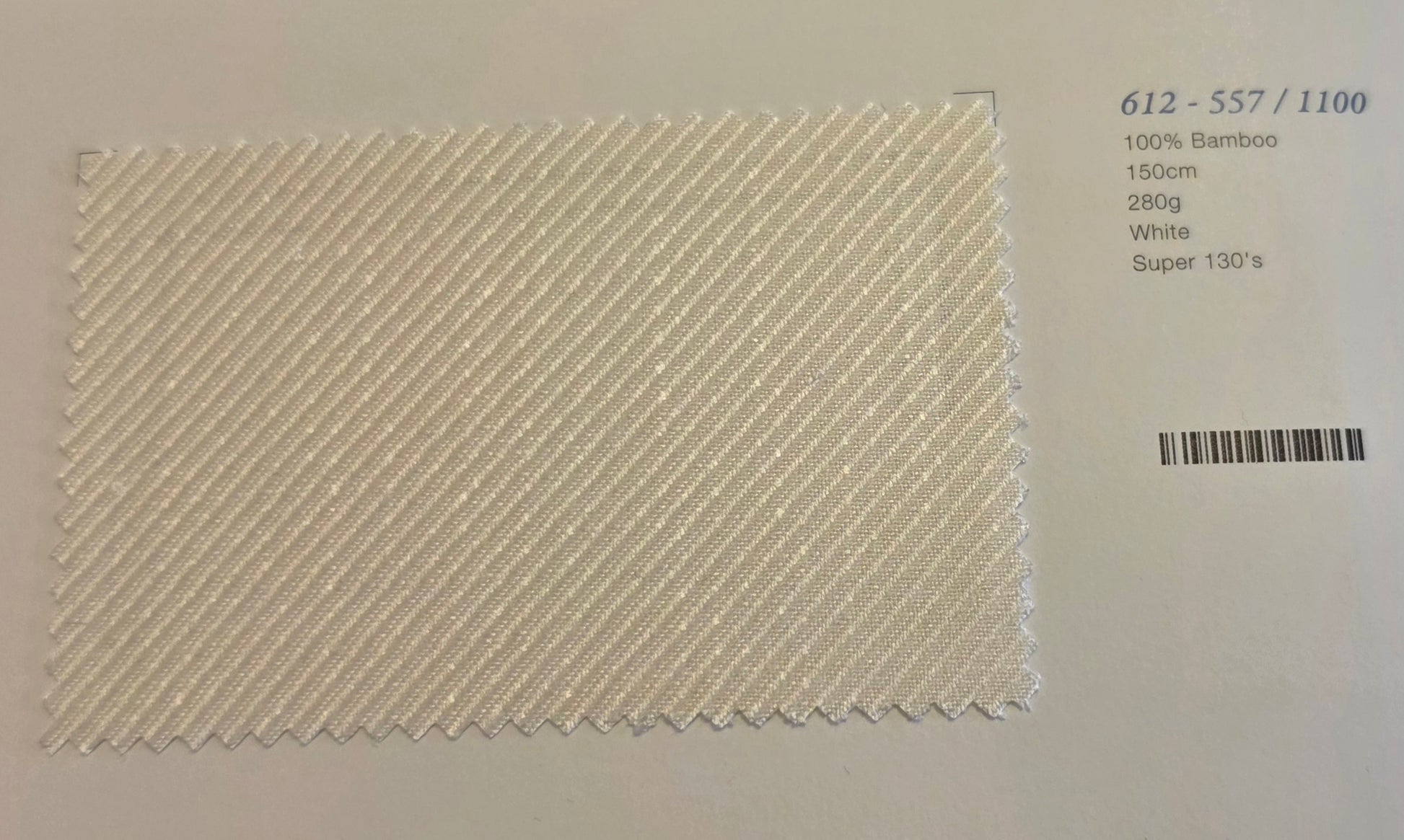 A square fabric swatch of white bamboo twill showing a diagonal textured pattern, displayed on a white background with product details printed on the right.