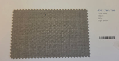 A square fabric swatch with serrated edges in a light brown woven material, shown on a white background with printed text and a bar-code to the right.